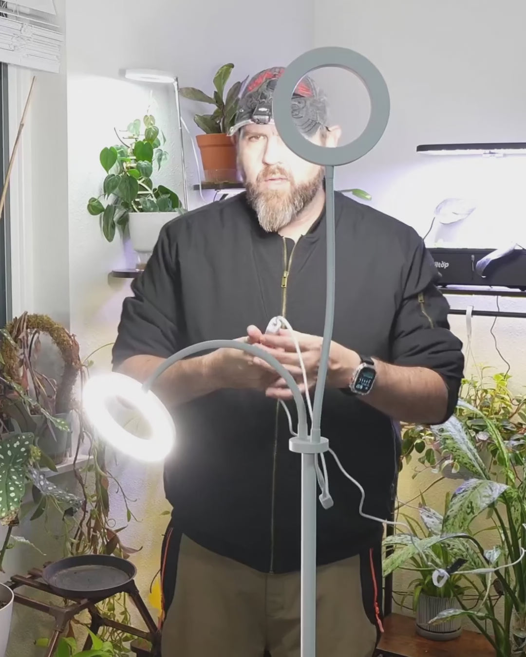 Hands-on video of home creators demonstrating the Glowrium G2 dual-head floor plant lamp in their living rooms, sharing vertical testimonials and real growth results for tall potted greens